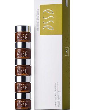 A stack of five small brown jars with silver lids, each labeled "Esse Omega Rich Moisturiser," is placed next to a rectangular white and yellow box also labeled "Esse Omega Rich Moisturiser." The box has text indicating that it contains "5 x 10ml / 5 x 0.3 fl oz.