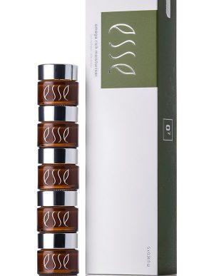 A stack of five small brown jars with white "Esse" labels, next to a tall white and green box featuring the "Esse" logo and the text "Esse Omega Rich Moisturiser.