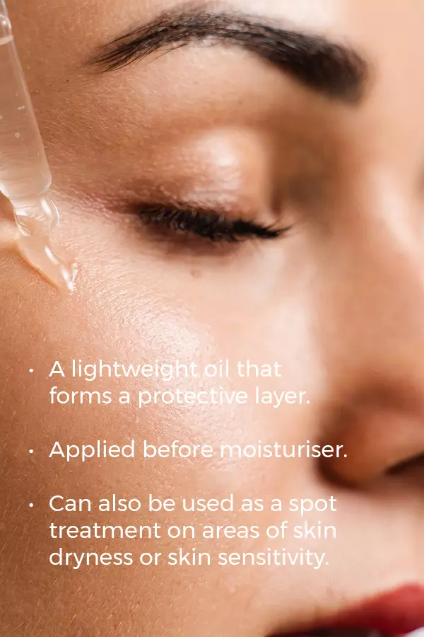 A close-up of a woman with closed eyes as a dropper applies Esse Protect Oil to her cheek. Text explains it creates a protective layer, should be used before moisturiser, and helps treat dryness or sensitivity.